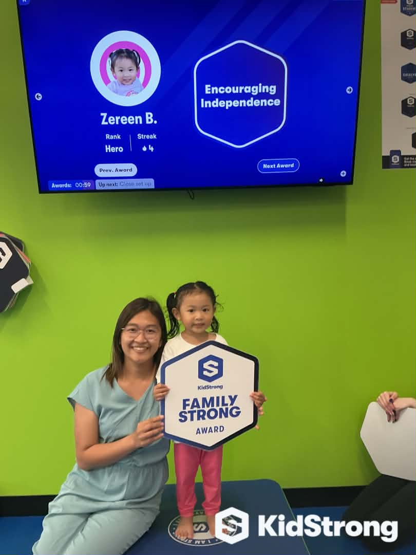 Charm and her daughter celebrating a Family Strong award together